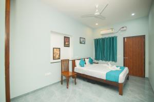 Ένα ή περισσότερα κρεβάτια σε δωμάτιο στο Sk Grand Villa, Heritage Inn