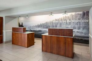 a room with a wall with a picture on the wall at La Quinta by Wyndham Bakersfield North in Bakersfield +40 photos