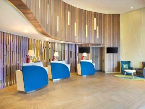 Televiisor ja/või meelelahutuskeskus majutusasutuses Ibis Styles Bogor Raya