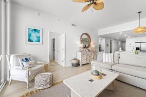 a living room with a couch and a table at Spanish Key 603 in Perdido Key