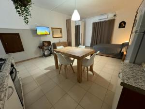 a kitchen and dining room with a table and chairs at ZIO PEPPE in Senise