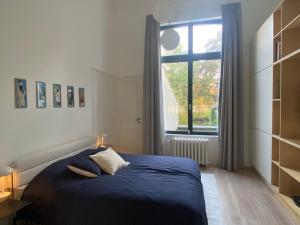 Postel nebo postele na pokoji v ubytování Canopée guesthouse