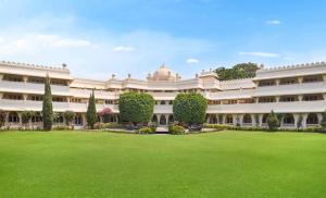 a large building with a lawn in front of it at Gateway Aurangabad - Chhatrapati Sambhaji Nagar in Aurangabad