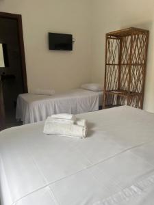 Cama ou camas em um quarto em Eco Pousada Mentawai