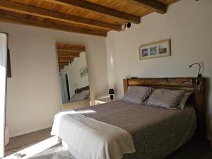 Ένα ή περισσότερα κρεβάτια σε δωμάτιο στο Cantinho da paz Peacefull Haven