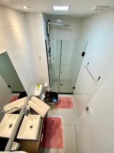 a bathroom with a sink and a shower at Seu cantinho in Sao Paulo