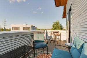 a patio with chairs and a table on a balcony at New Design-2 Miles to Broadway in Nashville