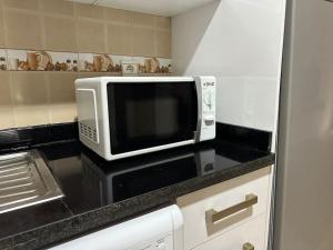 A kitchen or kitchenette at Cosy and practical apartment