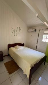 Postel nebo postele na pokoji v ubytování La petite maisonnette