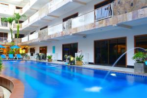 a large swimming pool in a hotel at Baan Boa Resort in Patong Beach