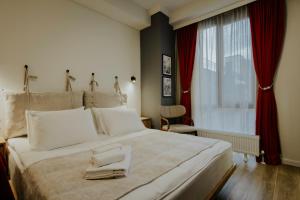 Postel nebo postele na pokoji v ubytování Luxury Inn Grand Residences