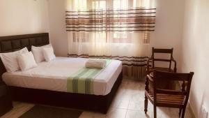 Ένα ή περισσότερα κρεβάτια σε δωμάτιο στο Elysian home villa