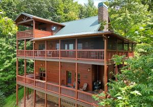 a large wooden house in the woods at Viva LaVista in Morganton