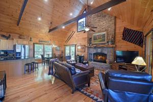 a living room with leather furniture and a fireplace at Viva LaVista in Morganton