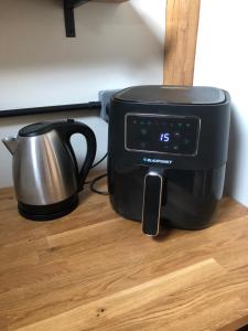 a toaster and a tea kettle on a table at The Barn Mid Bedfordshire in Haynes