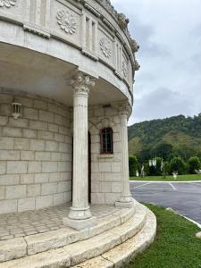 a stone building with a window on the side of it at Domaine Athéna in Pitres +4 photos