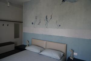 Postel nebo postele na pokoji v ubytování BLUMI Apartment