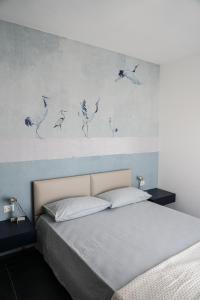 Postel nebo postele na pokoji v ubytování BLUMI Apartment