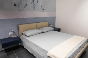 Postel nebo postele na pokoji v ubytování BLUMI Apartment
