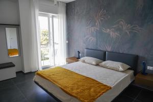 Postel nebo postele na pokoji v ubytování BLUMI Apartment