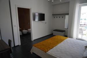 Postel nebo postele na pokoji v ubytování BLUMI Apartment