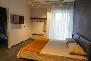 Postel nebo postele na pokoji v ubytování BLUMI Apartment