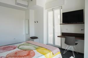 TV a/nebo společenská místnost v ubytování BLUMI Apartment