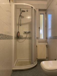 a bathroom with a shower and a toilet at B&B Anna in Montescaglioso +30 photos