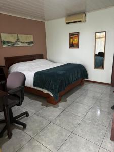 Postel nebo postele na pokoji v ubytování Hotel Vale's