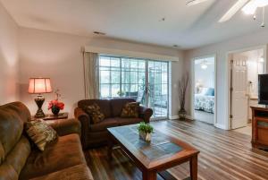 a living room with a couch and a coffee table at Daydreamer - Beautiful Views & Location in Branson