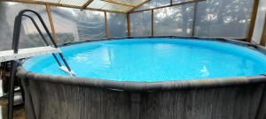 a large swimming pool in a building with at Nedleys Chardonnay in La Vignere