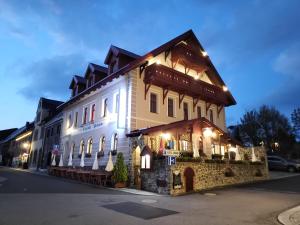 a large building with lights on it at night at FeWo Bergblick - Oberwiesenthal in Kurort Oberwiesenthal
