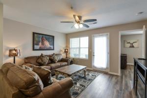 a living room with a couch and a table at Mystic Cove Condo - Pool - Perfect location in Branson