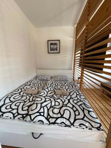 a bedroom with a large bed in a room at BLACKWOOD Kitchen in Bratislava