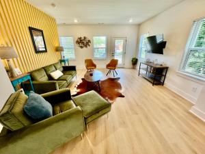 a living room with two couches and a television at Opry House Near Grand Ole Opry, Sleeps 10 in Nashville