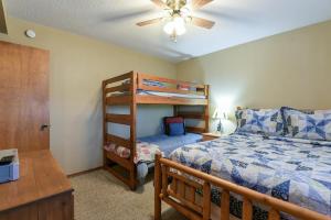 a bedroom with a bed and a bunk bed at Westcreek Ranch - No Stairs in Branson West