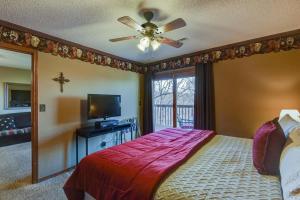 a bedroom with a bed and a ceiling fan at Westcreek Ranch - No Stairs in Branson West +25 photos