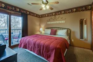 a bedroom with a large bed and a balcony at Westcreek Ranch - No Stairs in Branson West