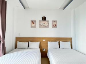 Postel nebo postele na pokoji v ubytování Thanh Hiền HB Hotel