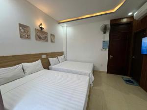 Postel nebo postele na pokoji v ubytování Thanh Hiền HB Hotel