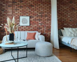 Łóżko lub łóżka w pokoju w obiekcie 7th Floor Apartment Mokotów