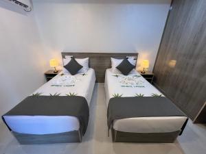 Letto o letti in una camera di INFINITE LAGOON
