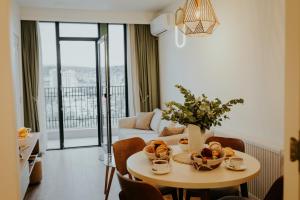 a living room with a table with fruit on it at Skyline Luxury Suites in Tbilisi City