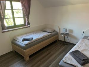 Postel nebo postele na pokoji v ubytování Penzion Kopanský mlýn