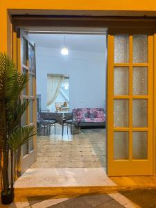 an open door of a house with a living room at Via Roma 55 in Lipari +86 photos