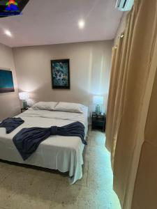 Postel nebo postele na pokoji v ubytování Deco Beach Villa 1 Beachfront + 14 fotografií