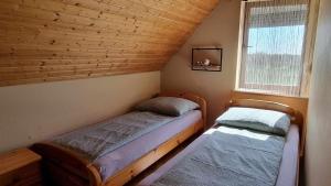 Postel nebo postele na pokoji v ubytování HutiFeri apartman + 37 fotografií