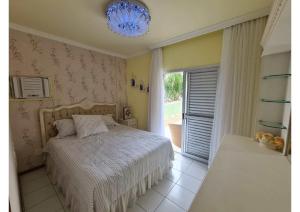 Postel nebo postele na pokoji v ubytování Apartamento Caioba
