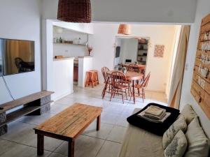 a living room with a couch and a table at Casa bohé Casilda in Casilda