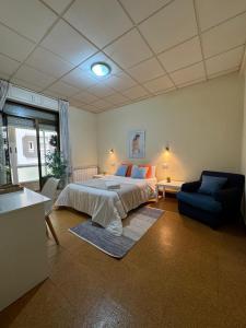 Postel nebo postele na pokoji v ubytování Hostal Real